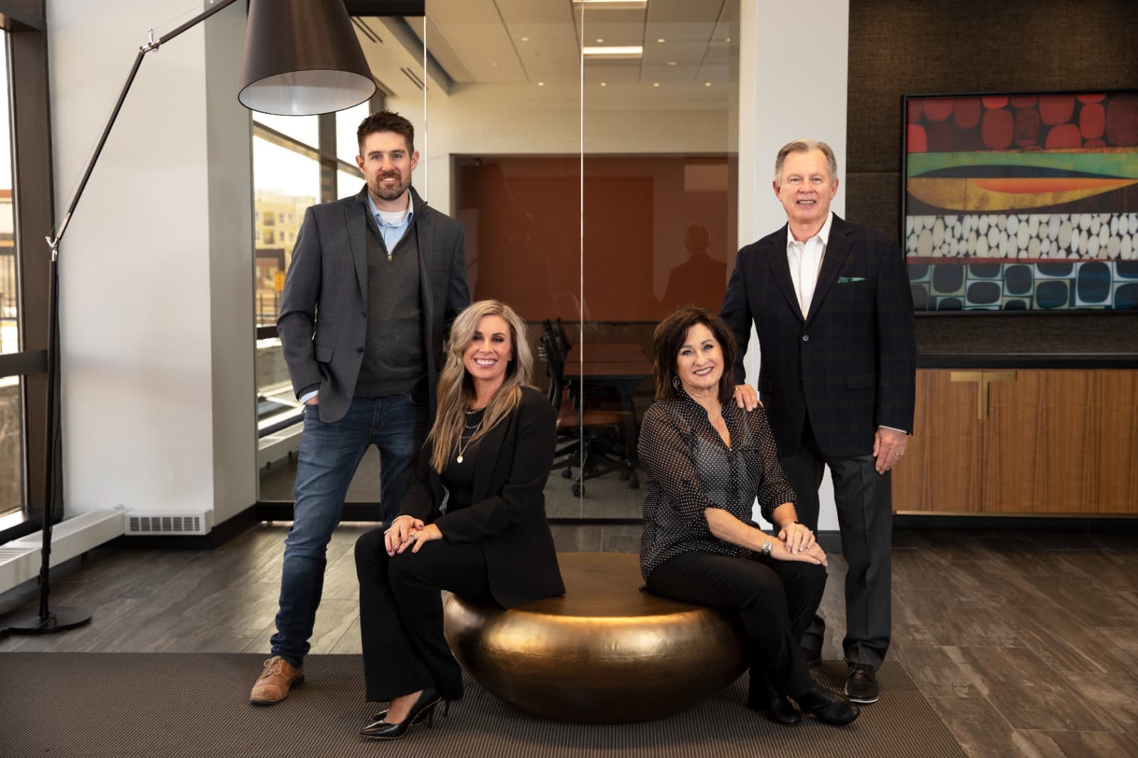 The four family owners behind CompassCom, CompassData, and CompassDrone, pictured together